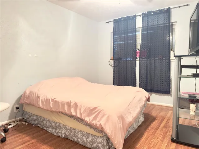 a large bed sitting in a bedroom next to a bathroom
