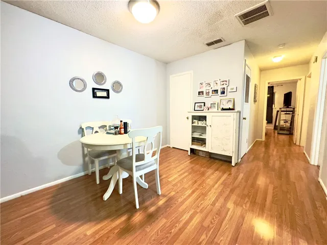 a dining room with a table and chairs