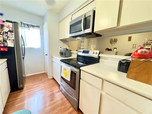 a kitchen with a stove and a microwave