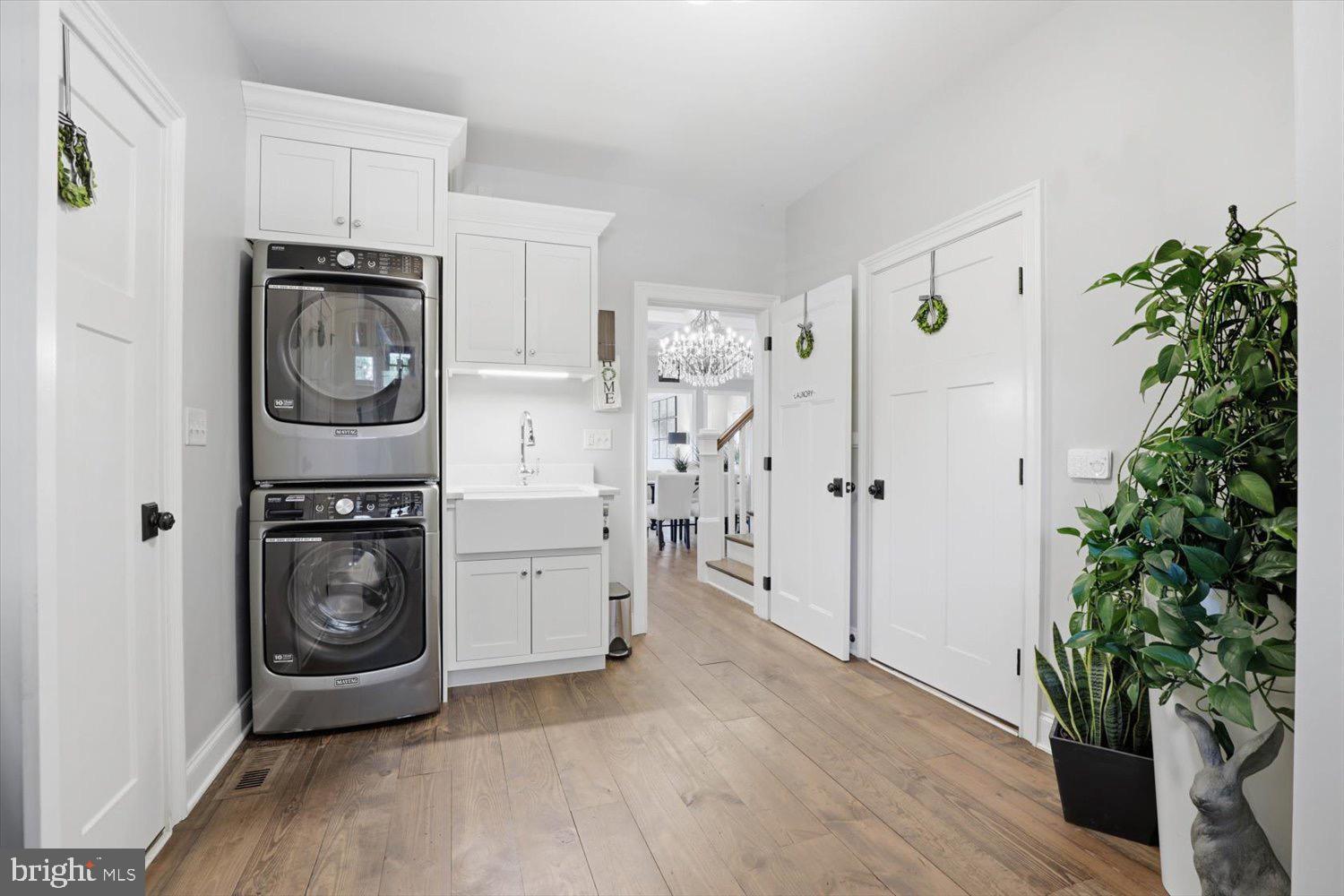 640 Snyder Road Lititz, PA 17543 - Photo 22 of 47 a utility room with sink a refrigerator and a potted plant