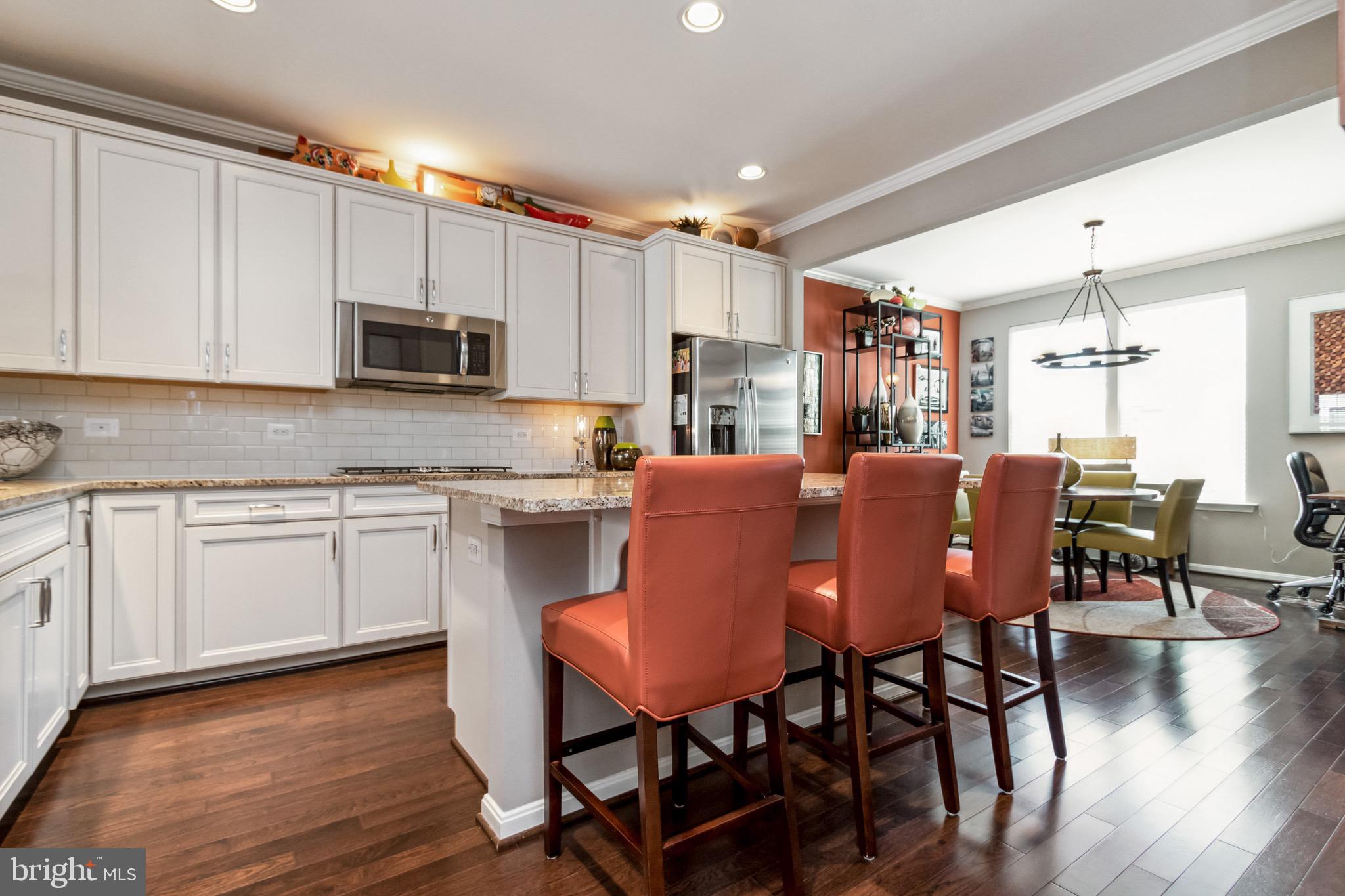 16008 Madison Ridge Place Gainesville, VA 20155 - Photo 6 of 35 Spacious Kitchen with Bar Stool Seating