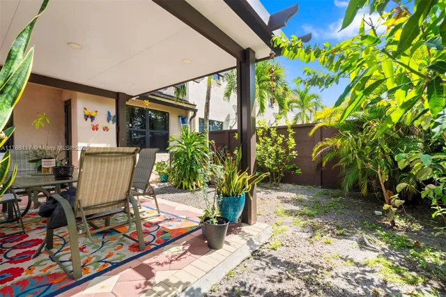 a view of a chairs and table in a patio