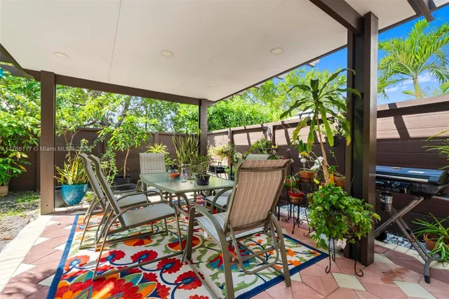 a view of a two chairs in the patio