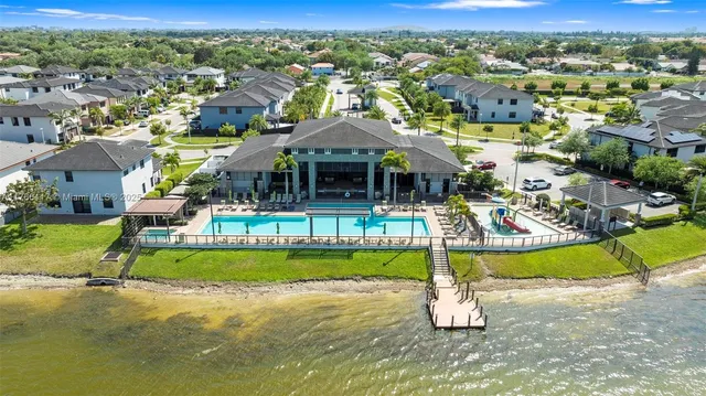 an aerial view of a house with a swimming pool