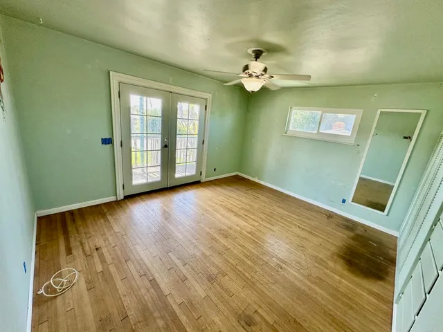 a bathroom with a granite countertop toilet sink and mirror