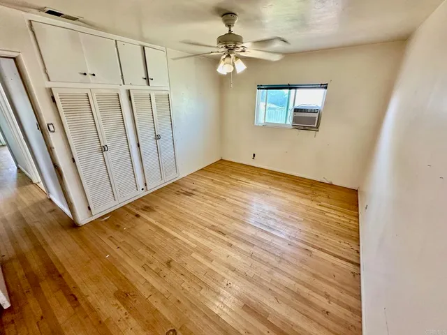 a bathroom with a sink mirror and vanity