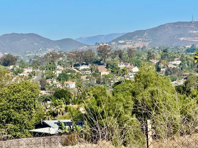 a view of a city with mountain