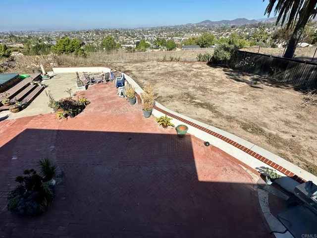 a view of a balcony with wooden floor