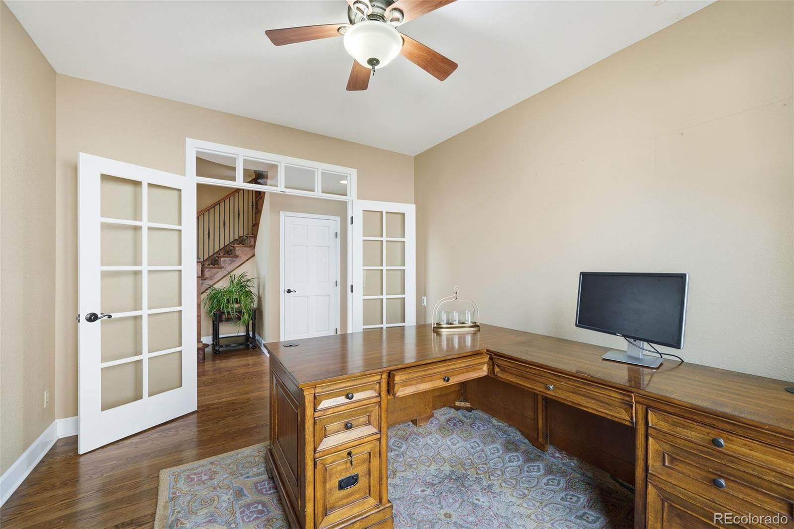 6879 Ingleton Drive Castle Pines, CO 80108 - Photo 11 of 50 a bedroom with furniture and wooden floor