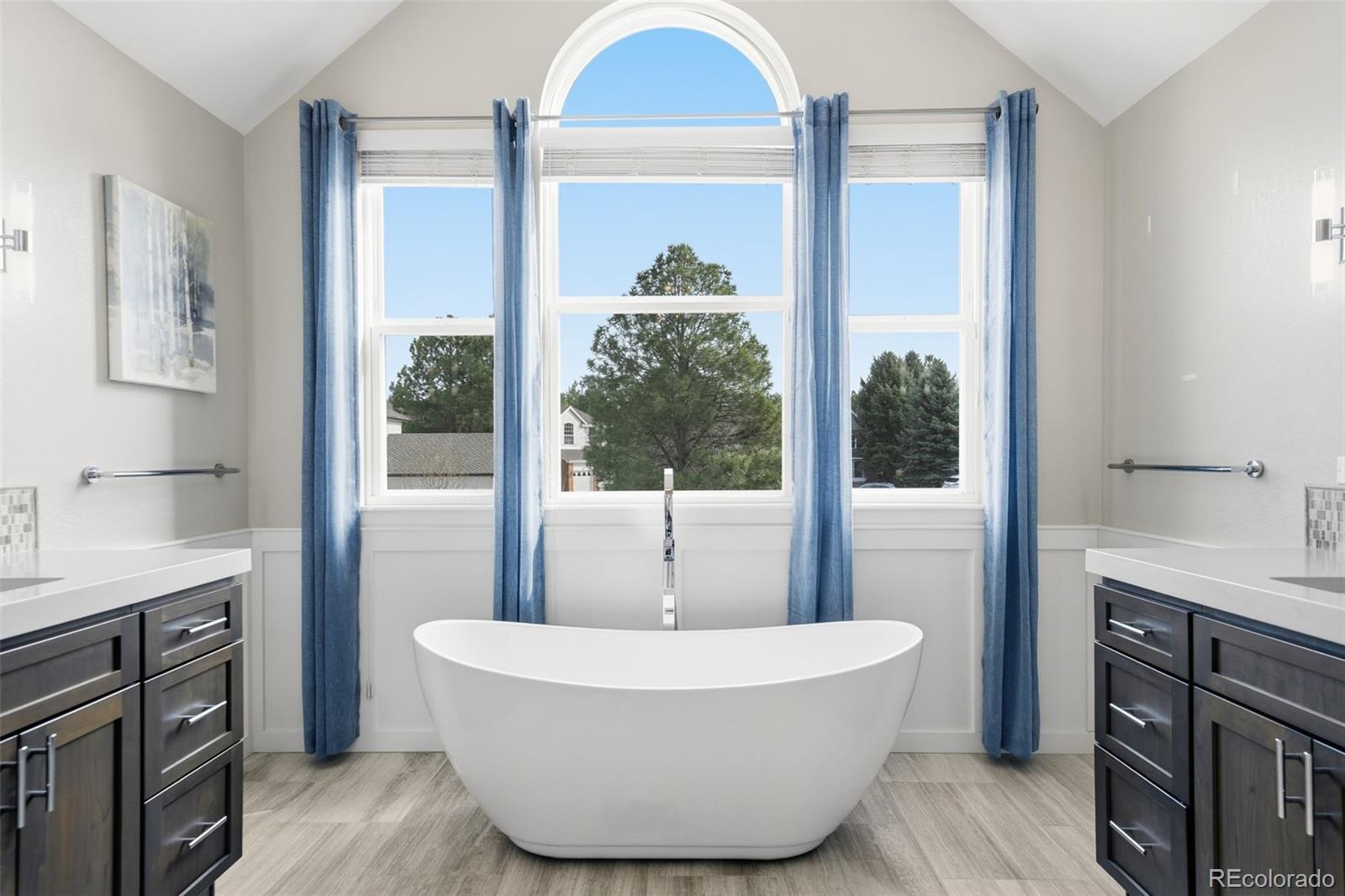 6879 Ingleton Drive Castle Pines, CO 80108 - Photo 24 of 50 a living room with a bed and a dresser next to a window