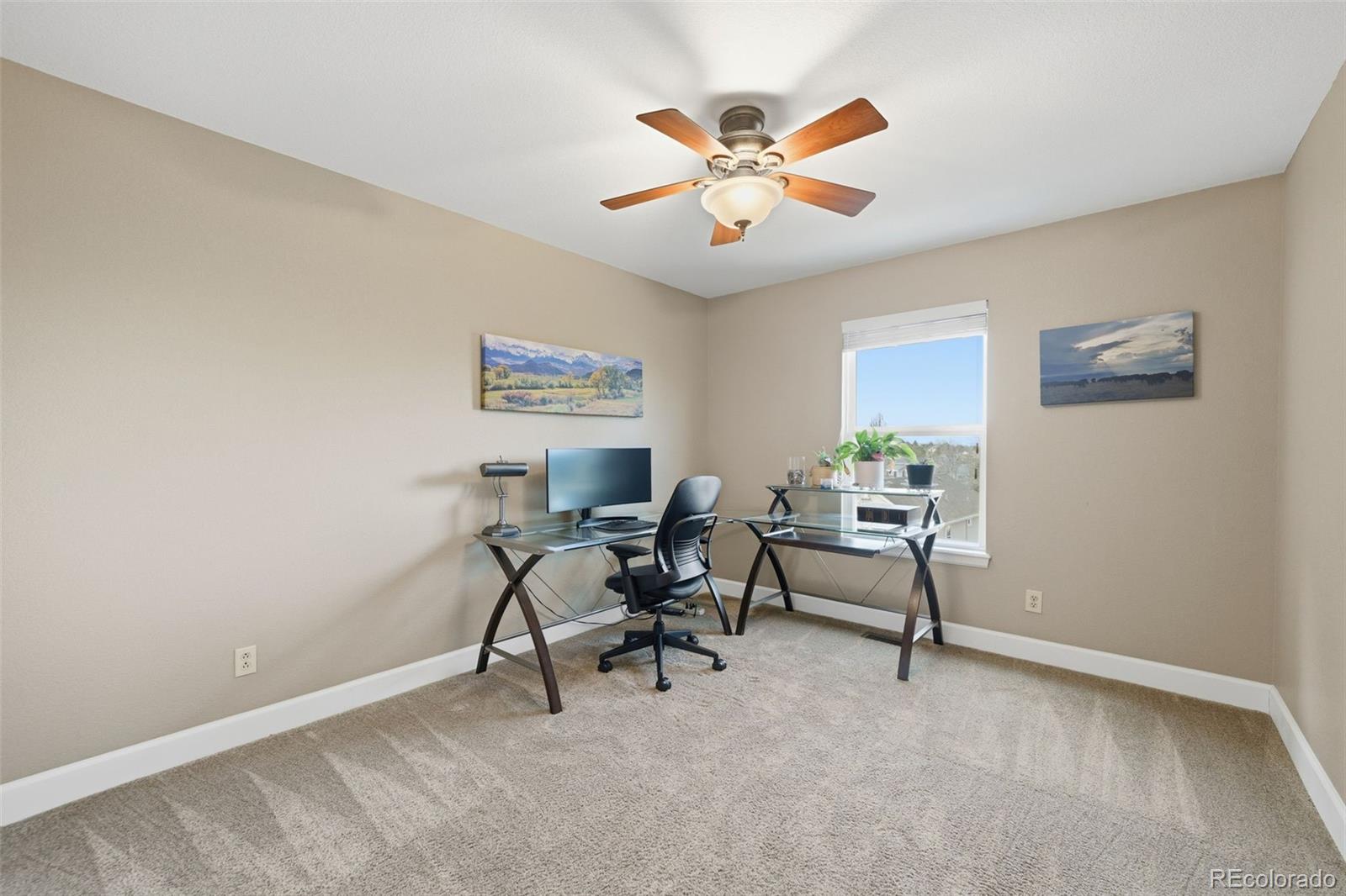 6879 Ingleton Drive Castle Pines, CO 80108 - Photo 26 of 50 a view of a workspace with furniture and a window