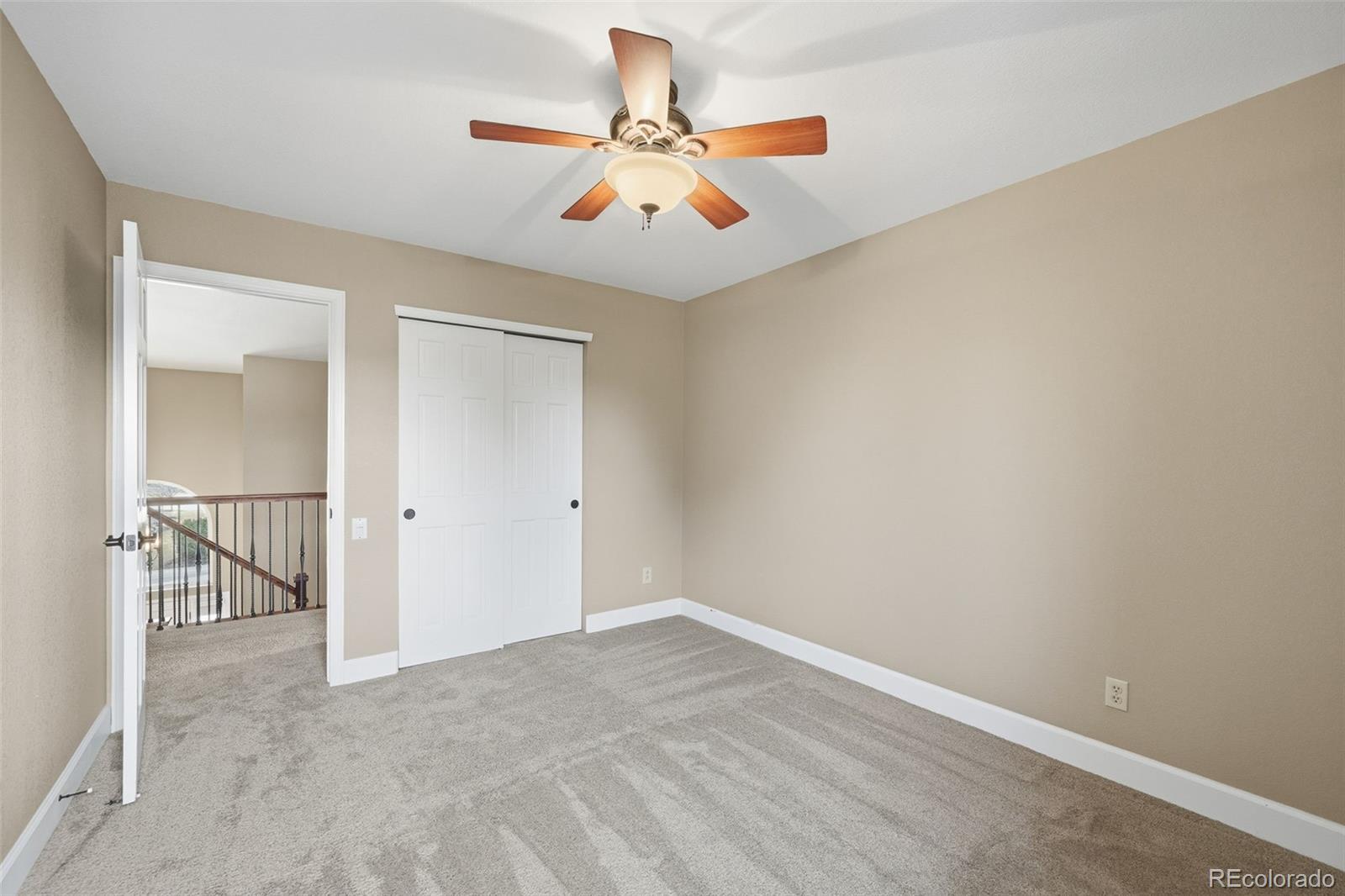 6879 Ingleton Drive Castle Pines, CO 80108 - Photo 31 of 50 a view of a room with a ceiling fan