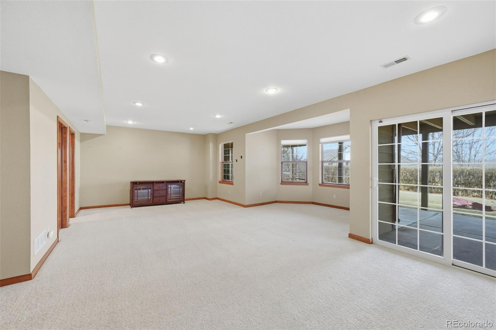 6879 Ingleton Drive Castle Pines, CO 80108 - Photo 35 of 50 a view of an empty room with glass door