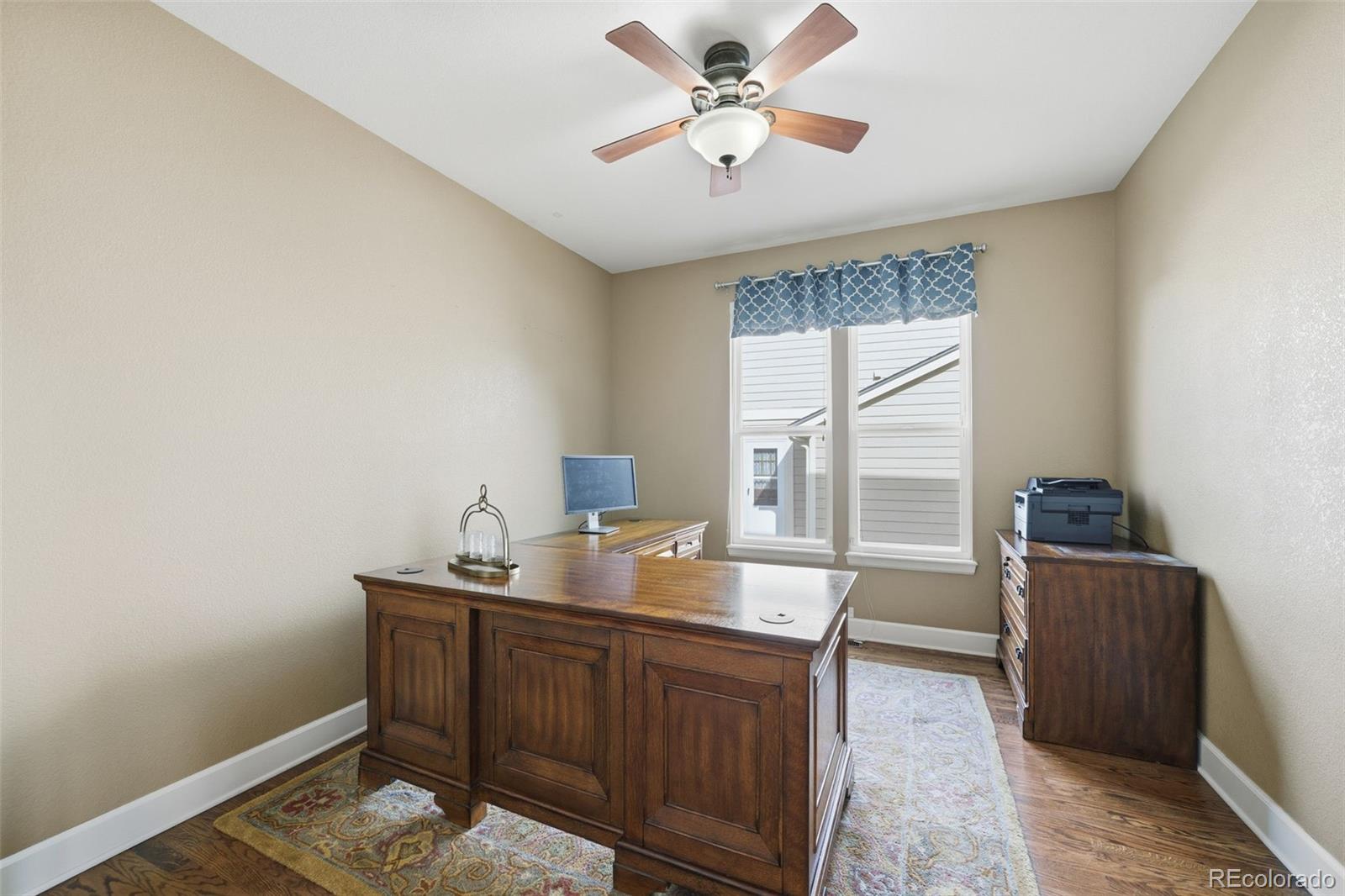 6879 Ingleton Drive Castle Pines, CO 80108 - Photo 10 of 50 a workspace with furniture and window