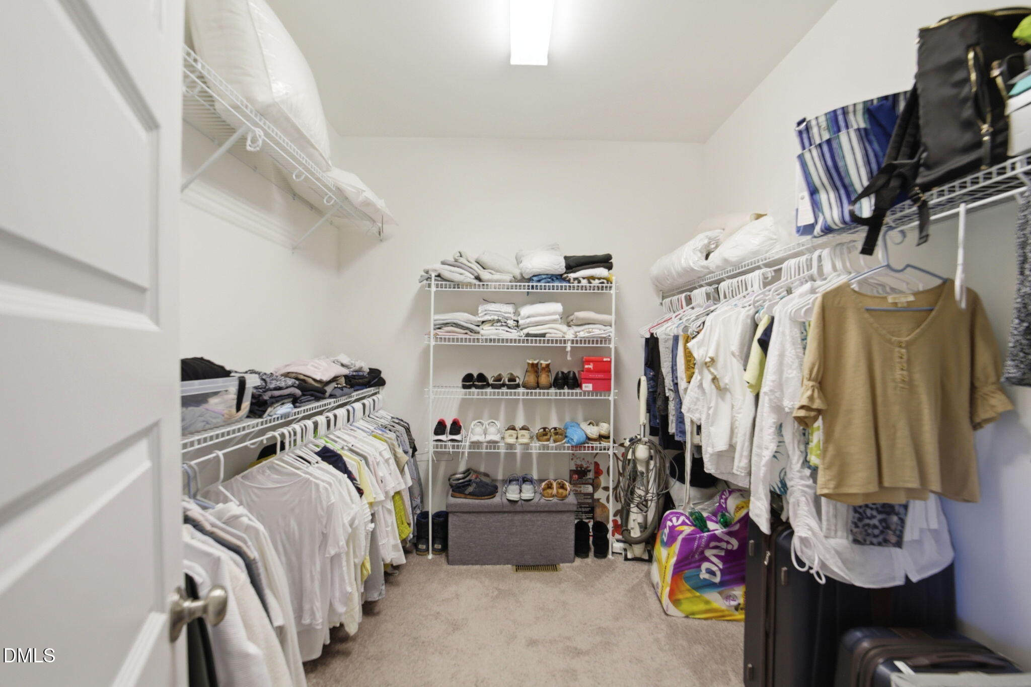 1547 Lassiter Pond Road Four Oaks, NC 27524 - Photo 20 of 45 a view of walk in closet with clothes and shoes