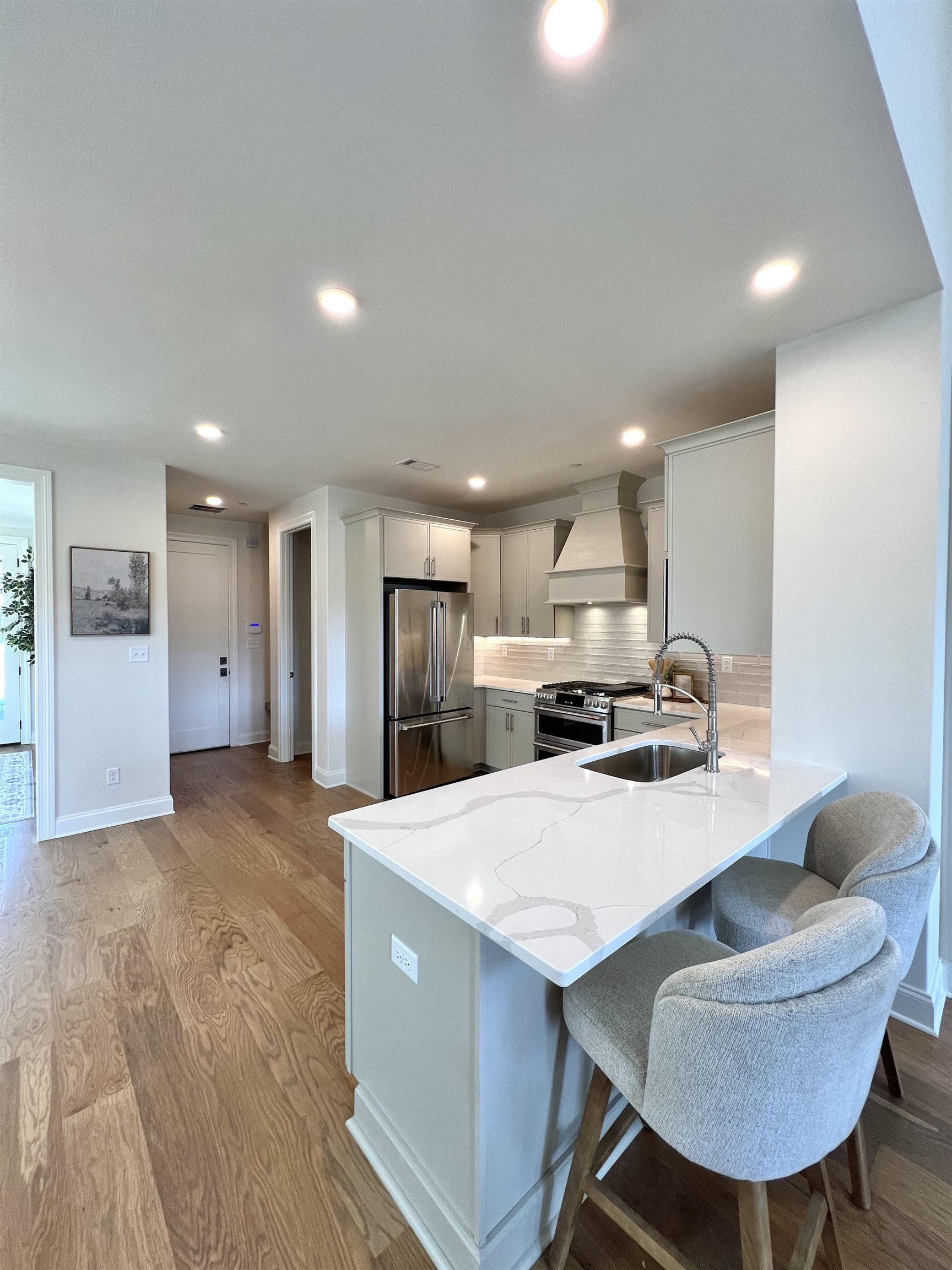 110 Rambling Rex Trail Collierville, TN 38017 - Photo 12 of 36 a large kitchen with kitchen island a sink table and chairs