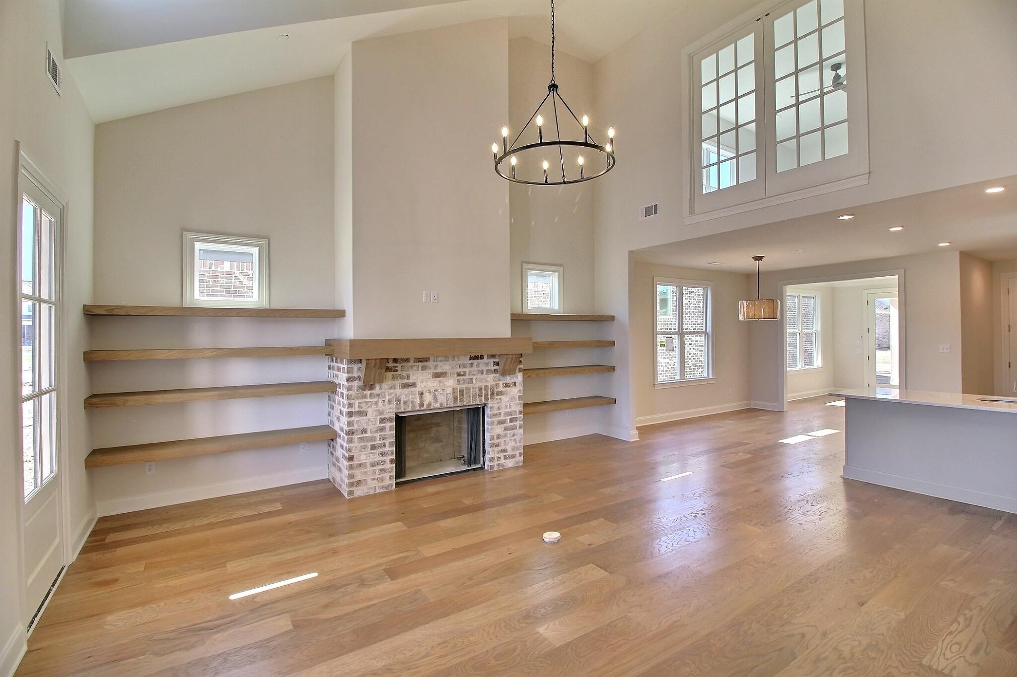 110 Rambling Rex Trail Collierville, TN 38017 - Photo 13 of 36 a view of an empty room with a fireplace and a window