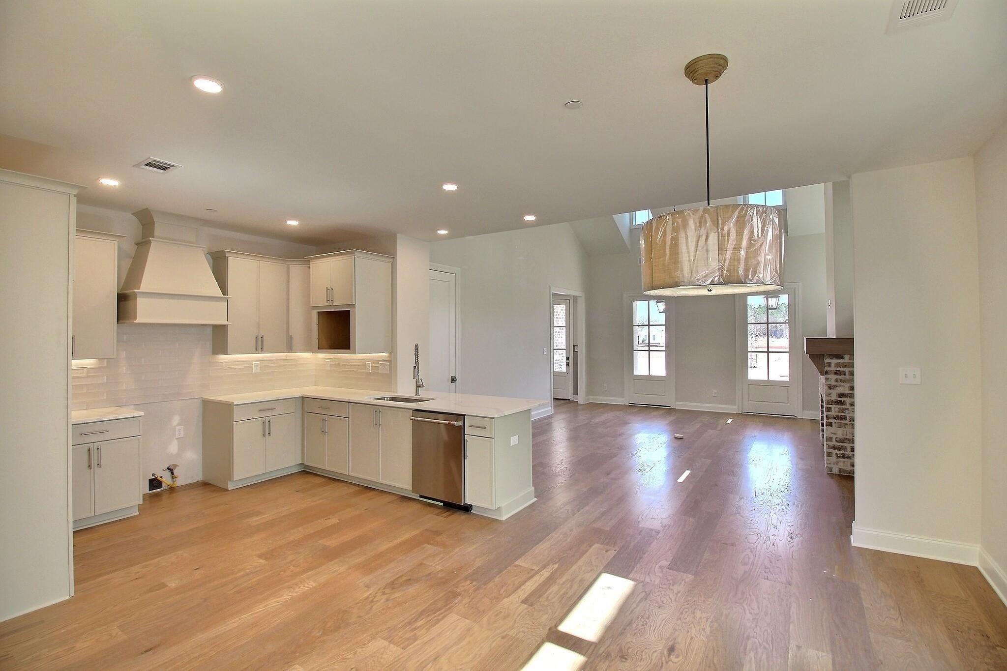 110 Rambling Rex Trail Collierville, TN 38017 - Photo 16 of 36 a view of kitchen and hall with wooden floor