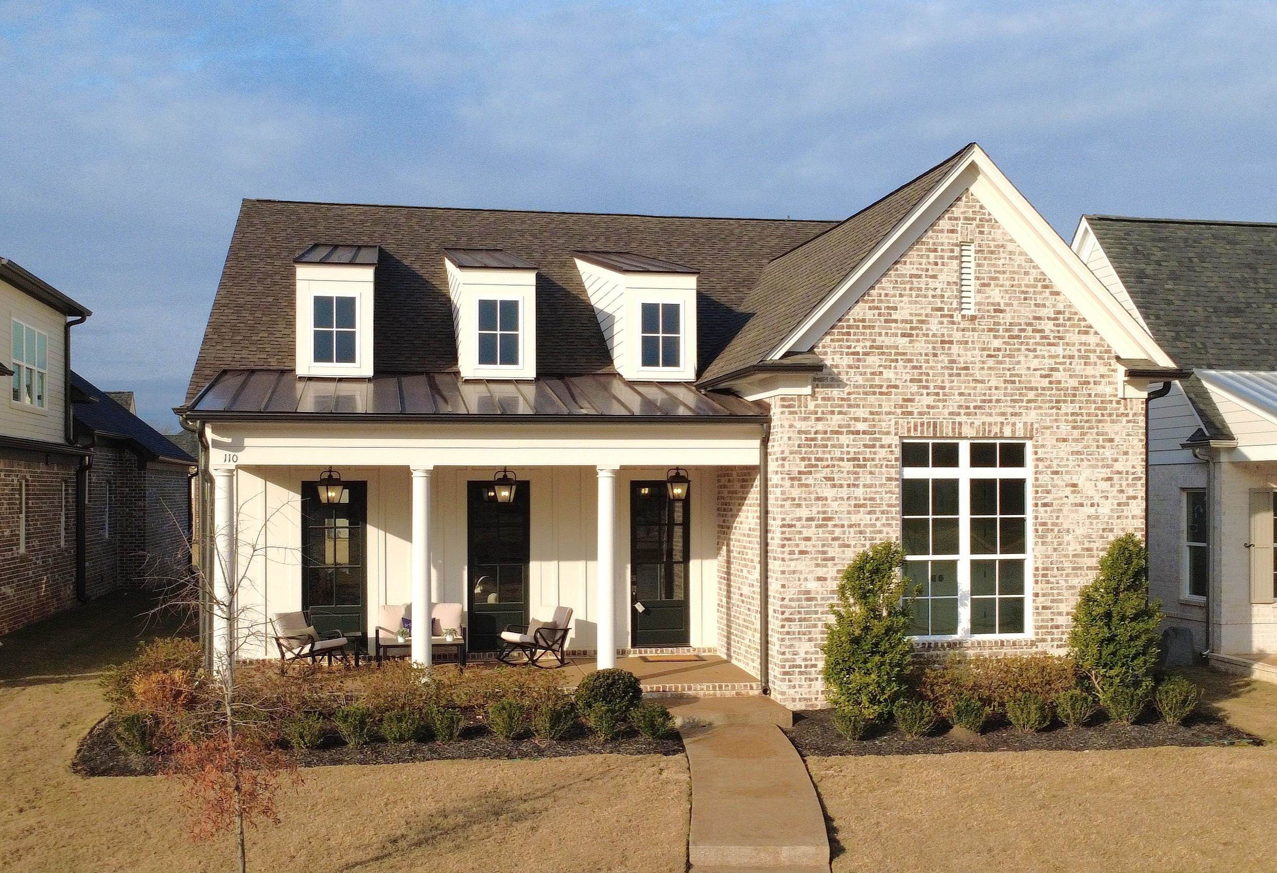 110 Rambling Rex Trail Collierville, TN 38017 - Photo 2 of 37 View of front of property featuring a standing seam roof, covered porch, and a metal roof