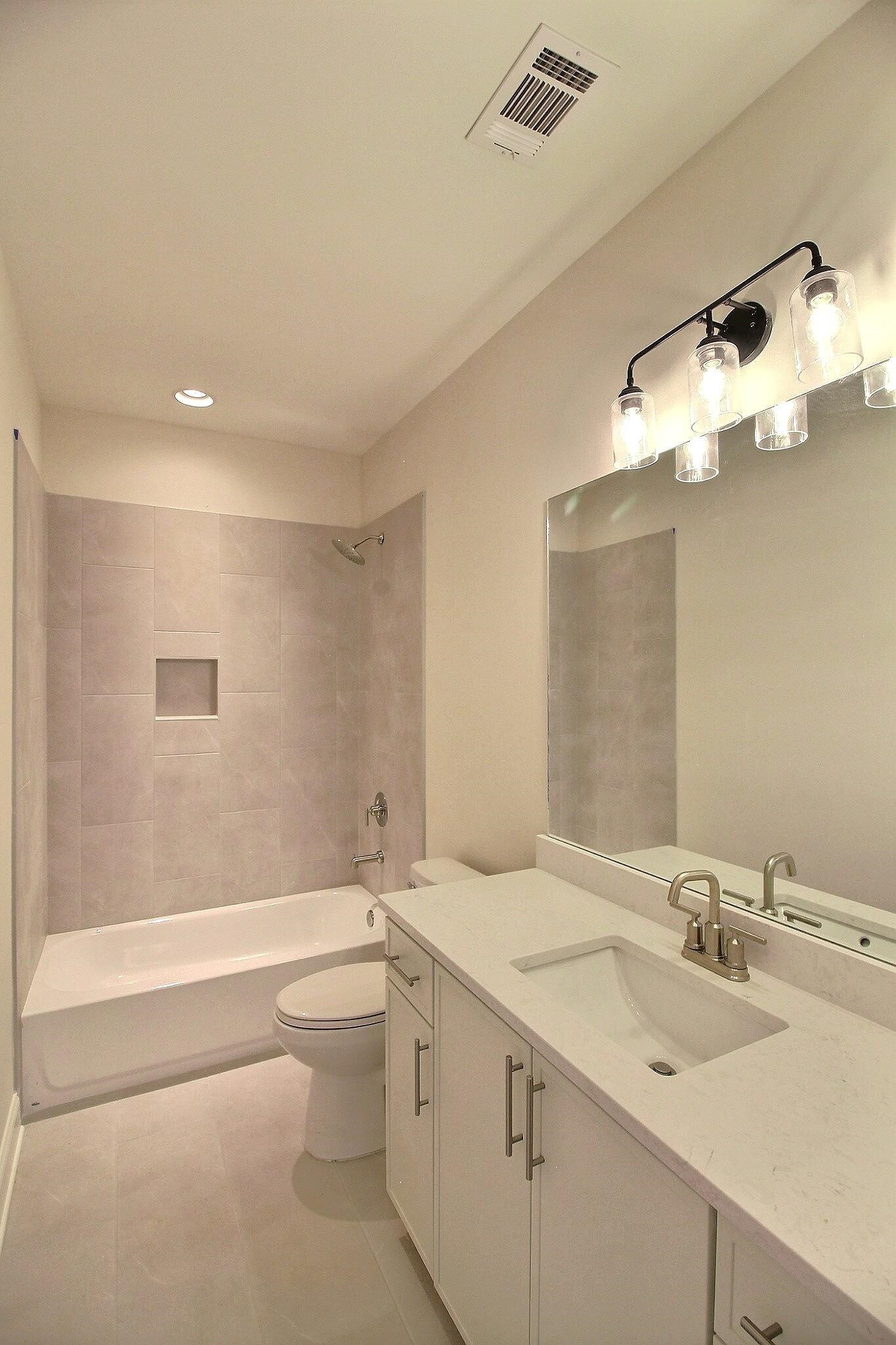 110 Rambling Rex Trail Collierville, TN 38017 - Photo 22 of 36 a bathroom with a sink a toilet and shower