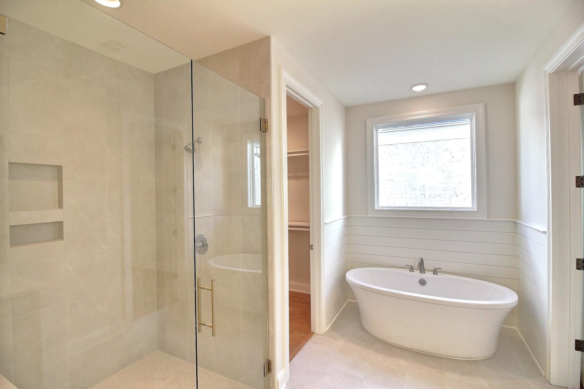 110 Rambling Rex Trail Collierville, TN 38017 - Photo 27 of 36 a bathroom with a bathtub and shower