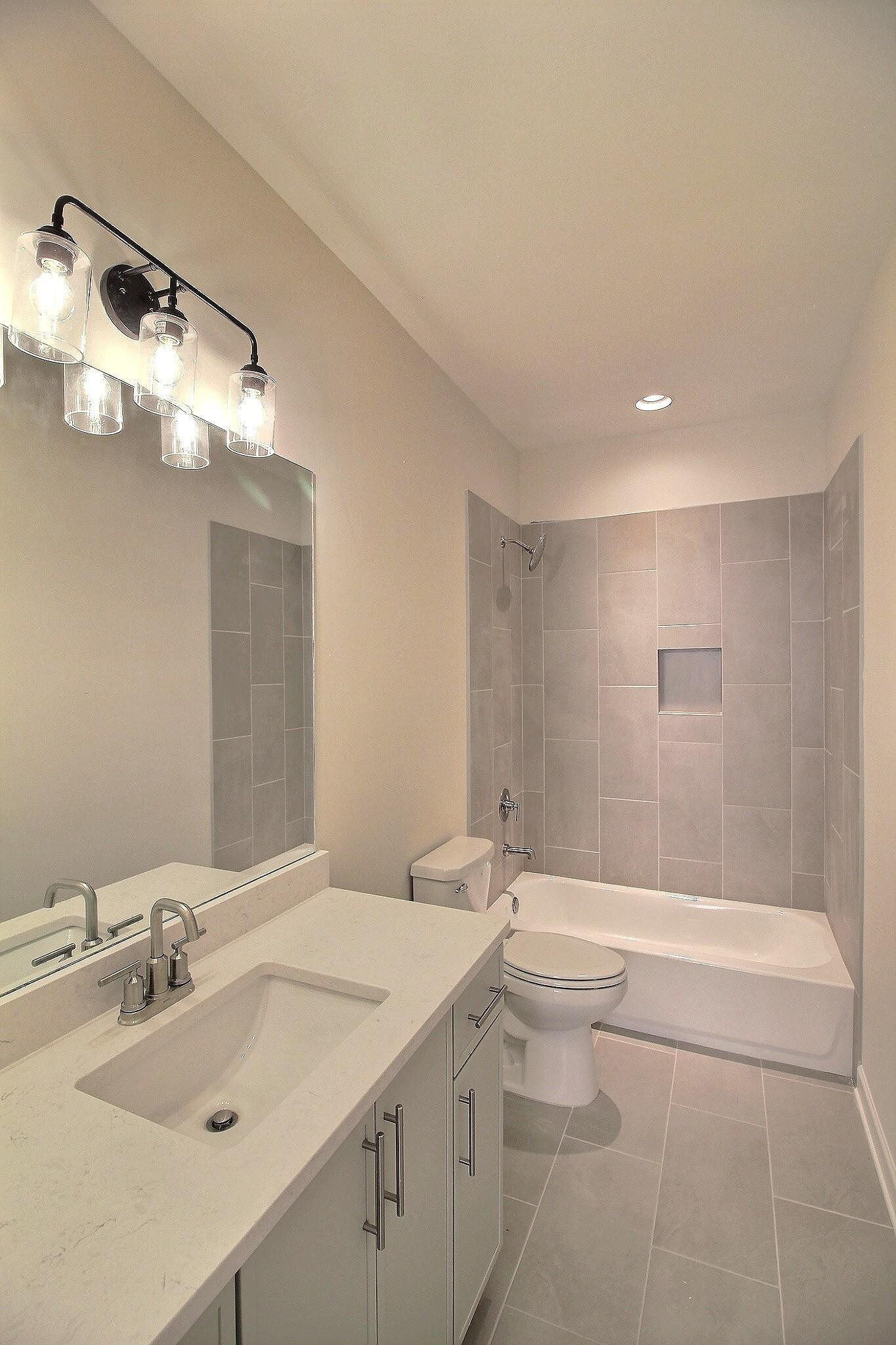 110 Rambling Rex Trail Collierville, TN 38017 - Photo 31 of 36 a bathroom with a sink a toilet and shower