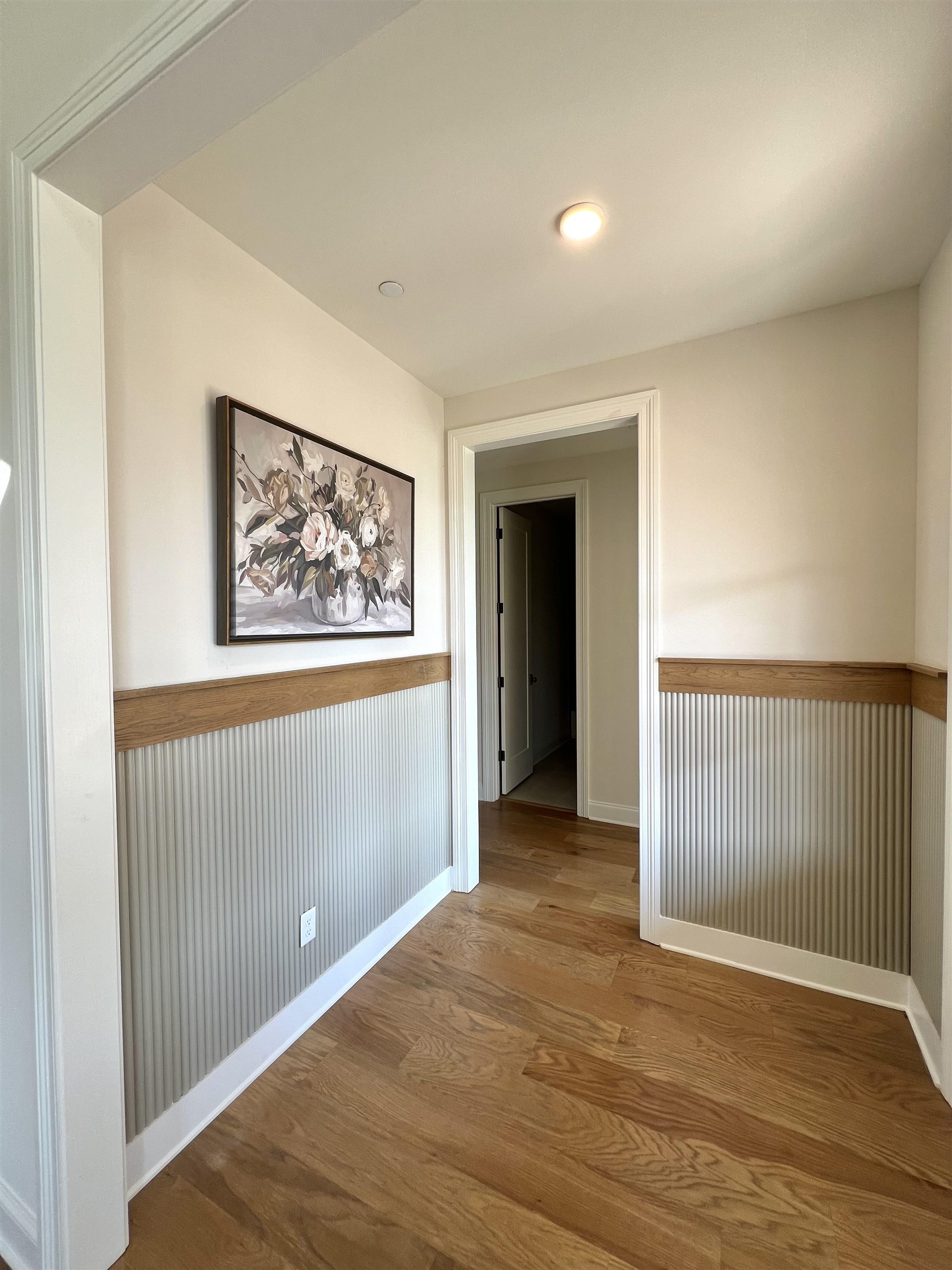 110 Rambling Rex Trail Collierville, TN 38017 - Photo 4 of 37 Corridor featuring light wood finished floors, a wainscoted wall, and recessed lighting