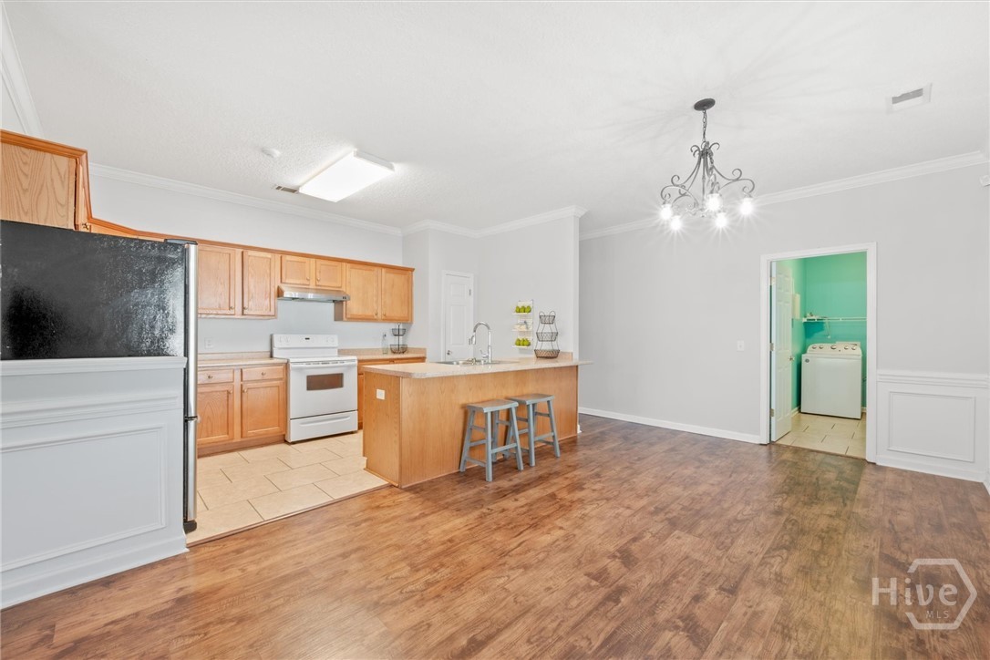 83 Fellwood Drive Rincon, GA 31326 - Photo 11 of 40 The dining room opens to the kitchen.