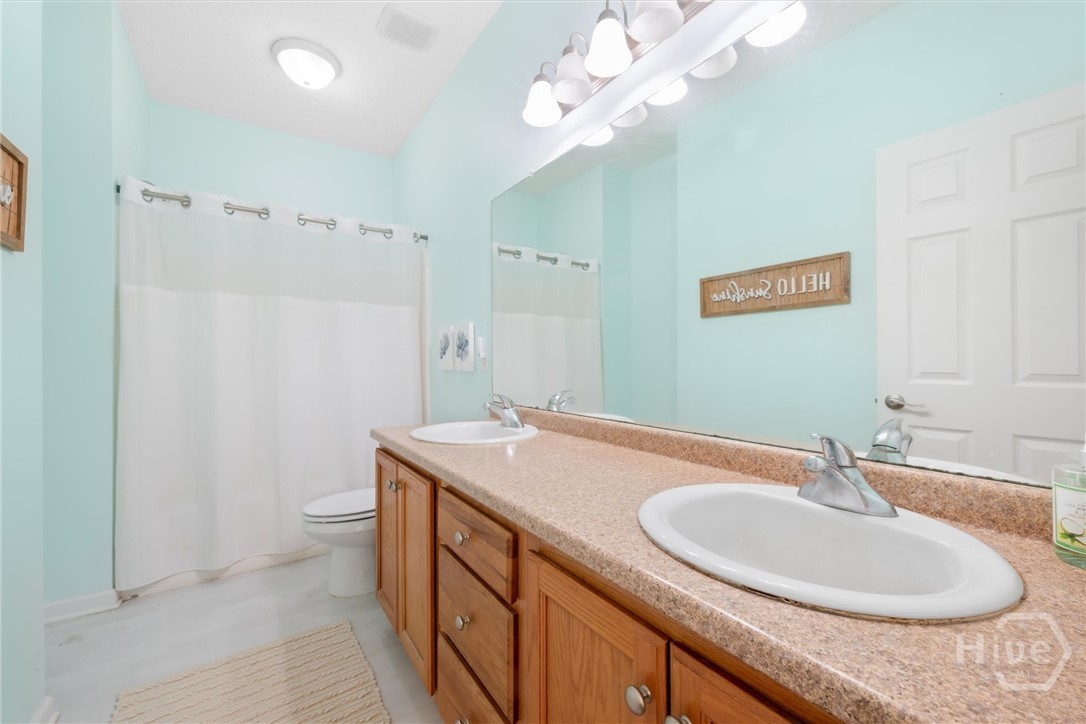 83 Fellwood Drive Rincon, GA 31326 - Photo 23 of 40 Expansive double vanity and shower over tub.