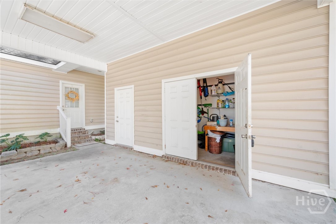 83 Fellwood Drive Rincon, GA 31326 - Photo 35 of 40 Storage or workshop area off the carport.