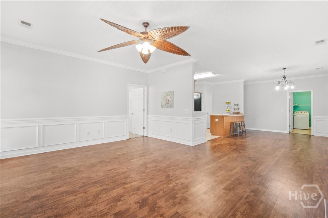 83 Fellwood Drive Rincon, GA 31326 - Photo 8 of 40 The living room opens to the dining room.
