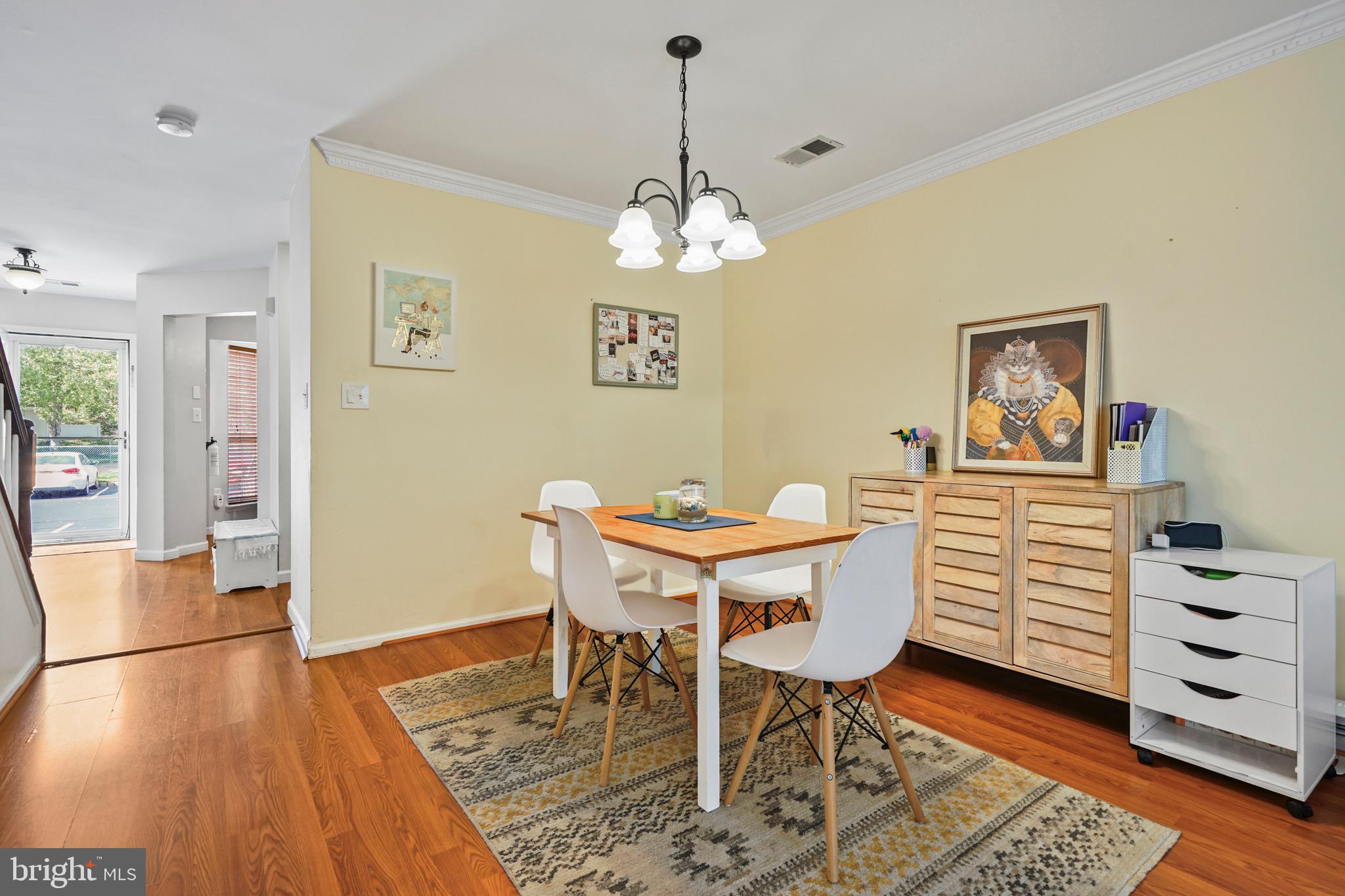 157 Setter Place Freehold, NJ 07728 - Photo 11 of 22 a view of a dining room with furniture and wooden floor