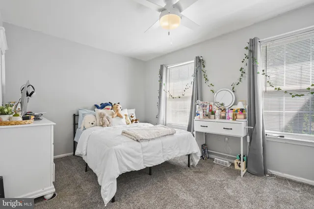 a bedroom with a bed and a table