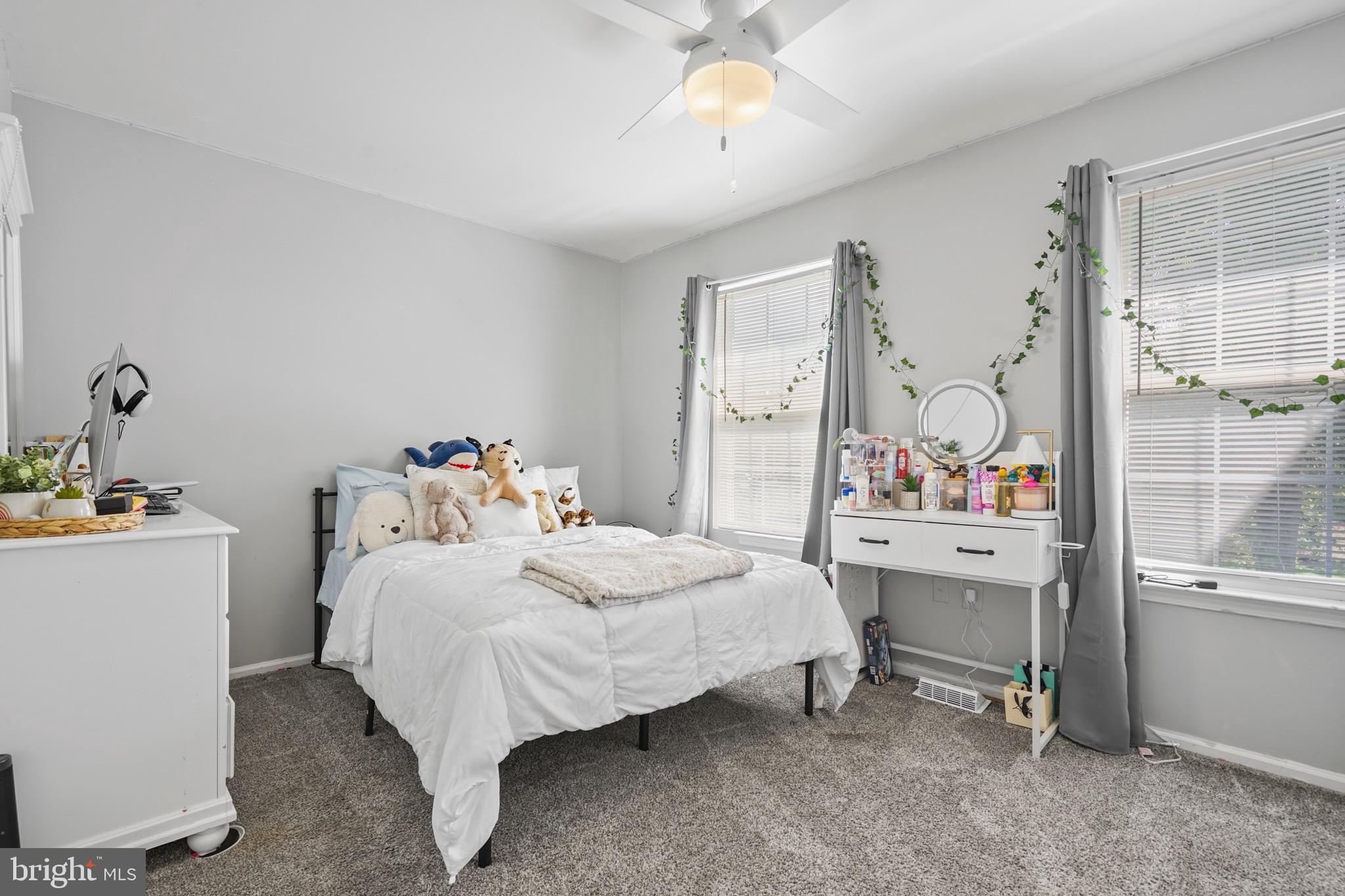 157 Setter Place Freehold, NJ 07728 - Photo 14 of 22 a bedroom with a bed and a table