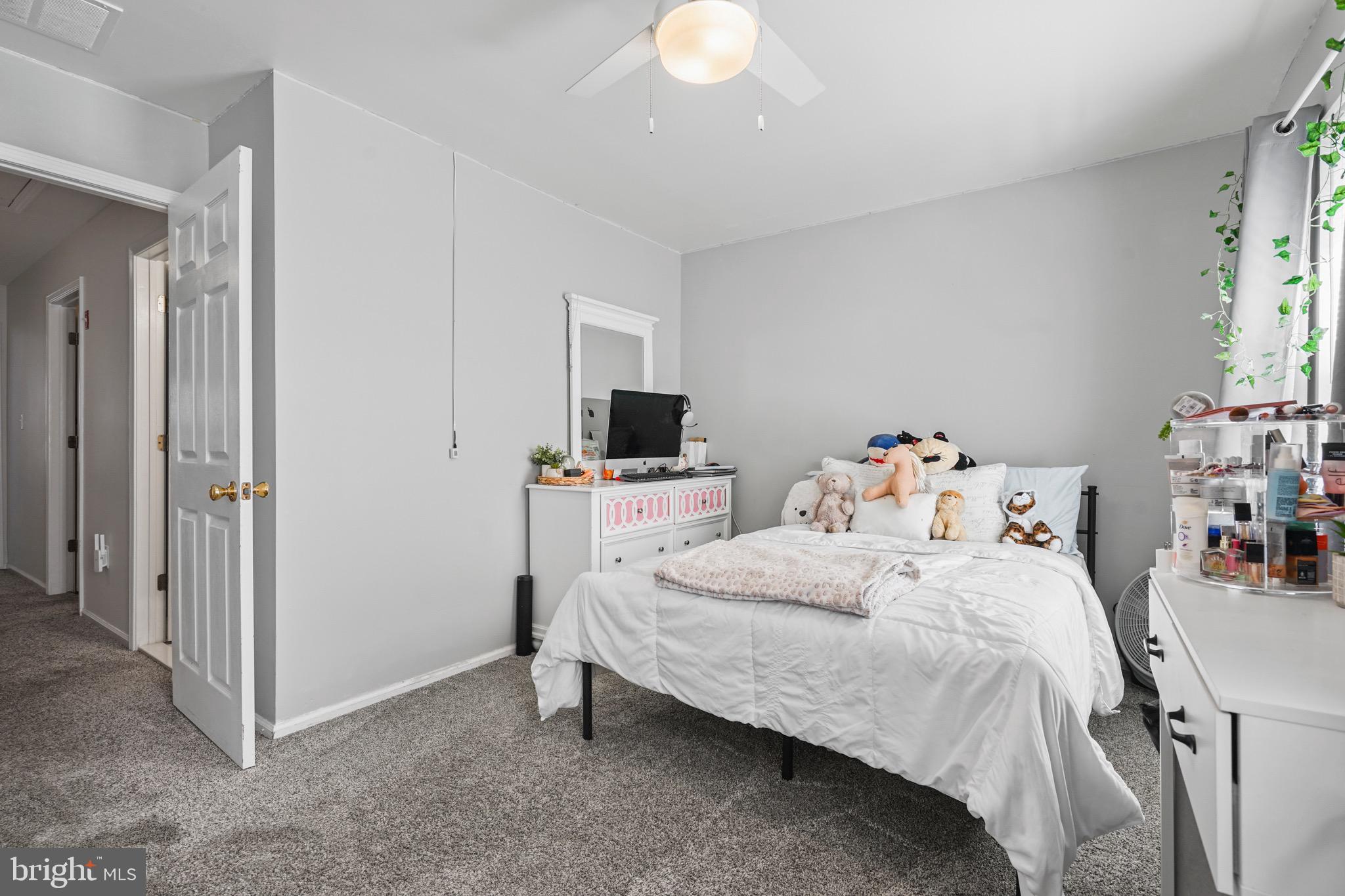 157 Setter Place Freehold, NJ 07728 - Photo 15 of 22 a bedroom with a bed and a window