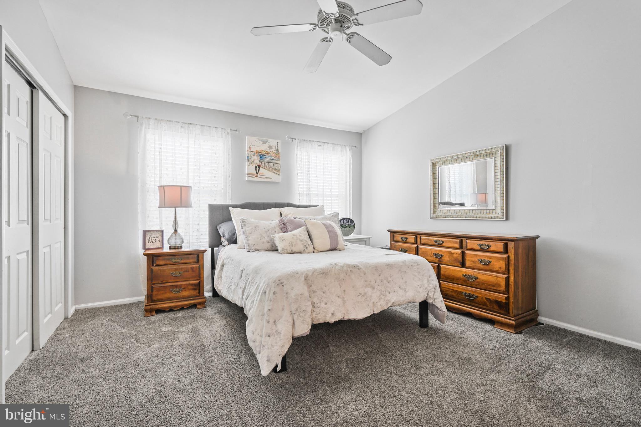 157 Setter Place Freehold, NJ 07728 - Photo 17 of 22 a spacious bedroom with a bed and a chandelier