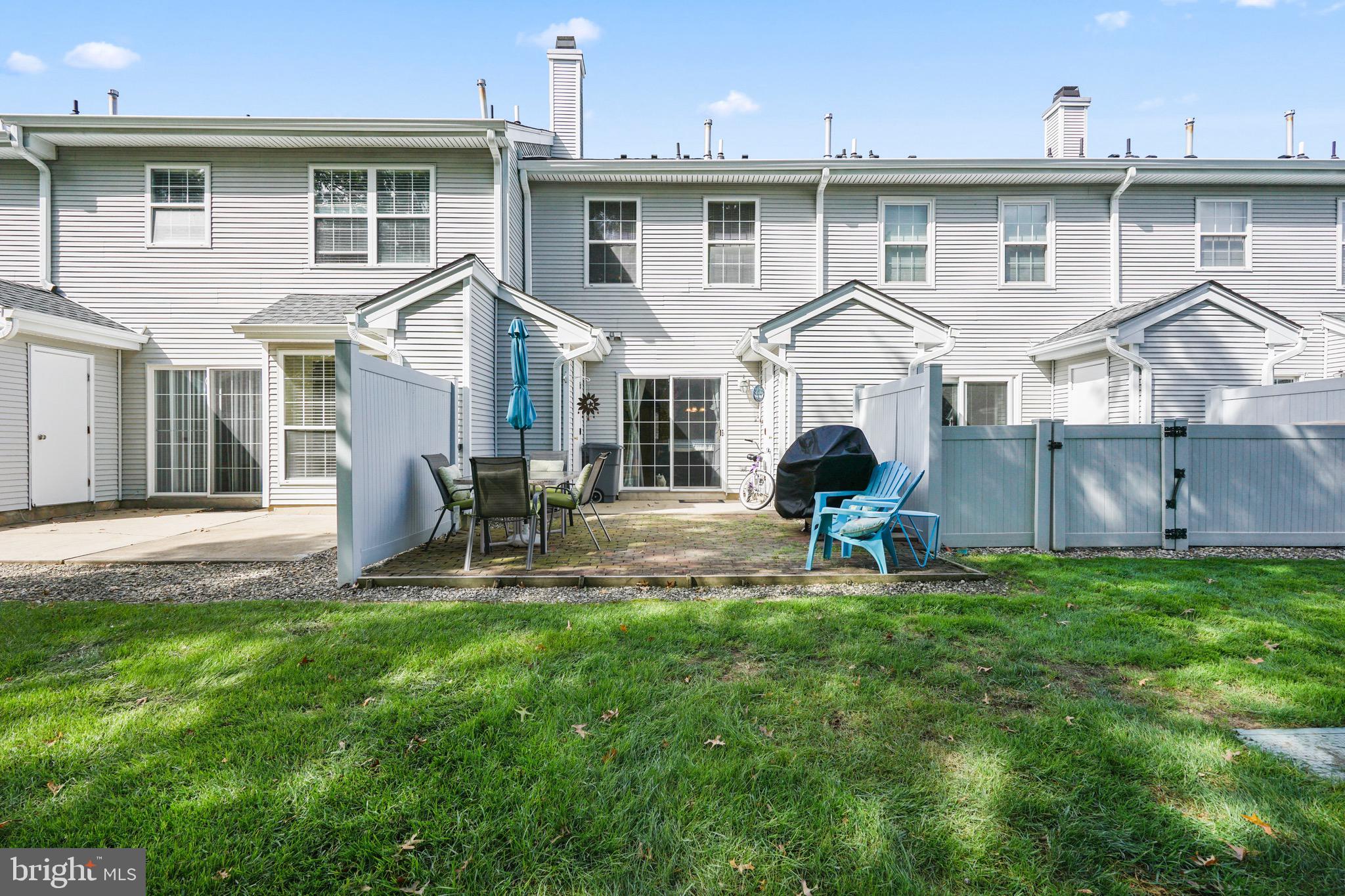 157 Setter Place Freehold, NJ 07728 - Photo 20 of 22 a front view of a house with a yard and porch
