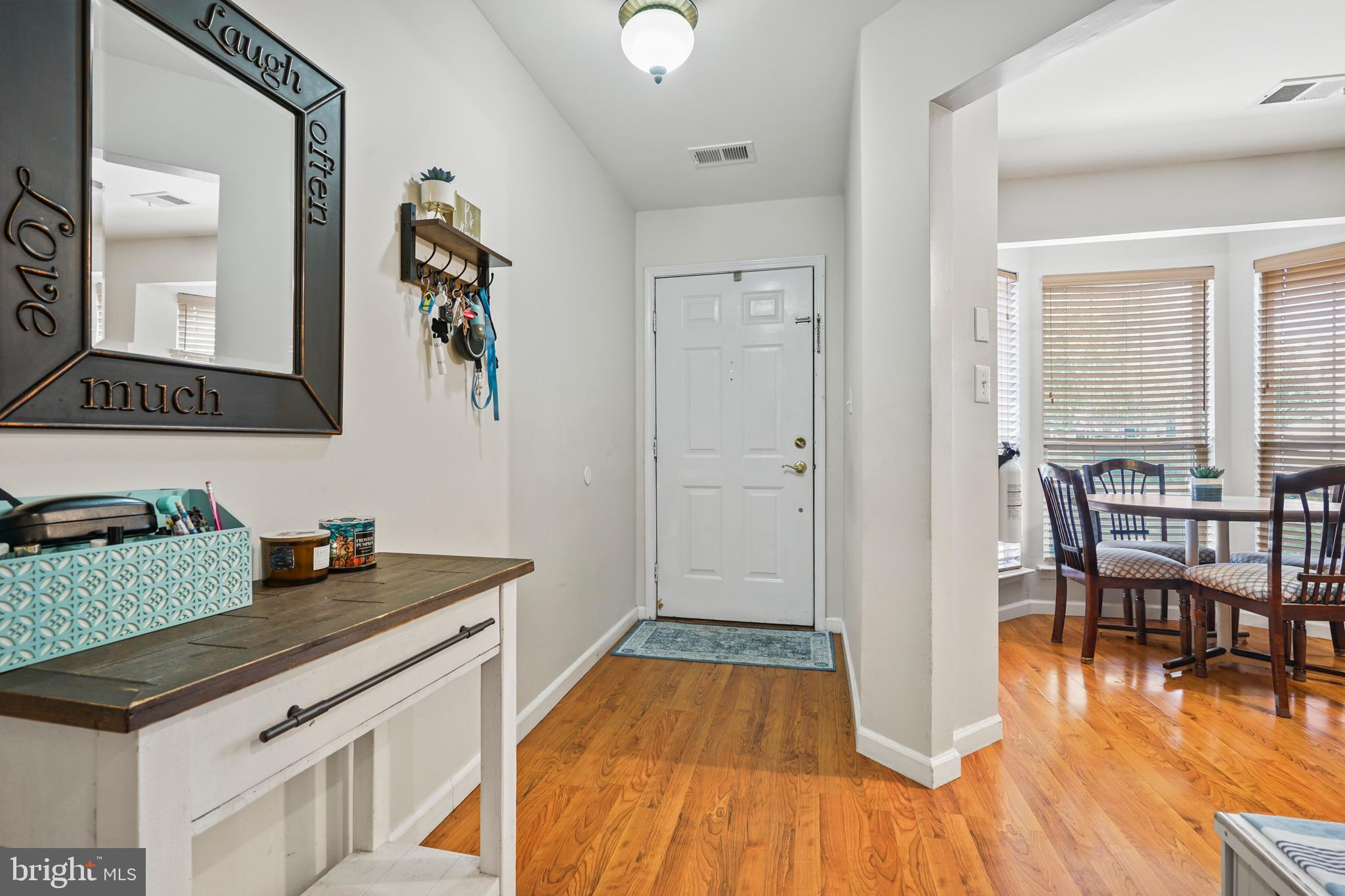 157 Setter Place Freehold, NJ 07728 - Photo 5 of 22 a kitchen view of a dining table chairs and entryway