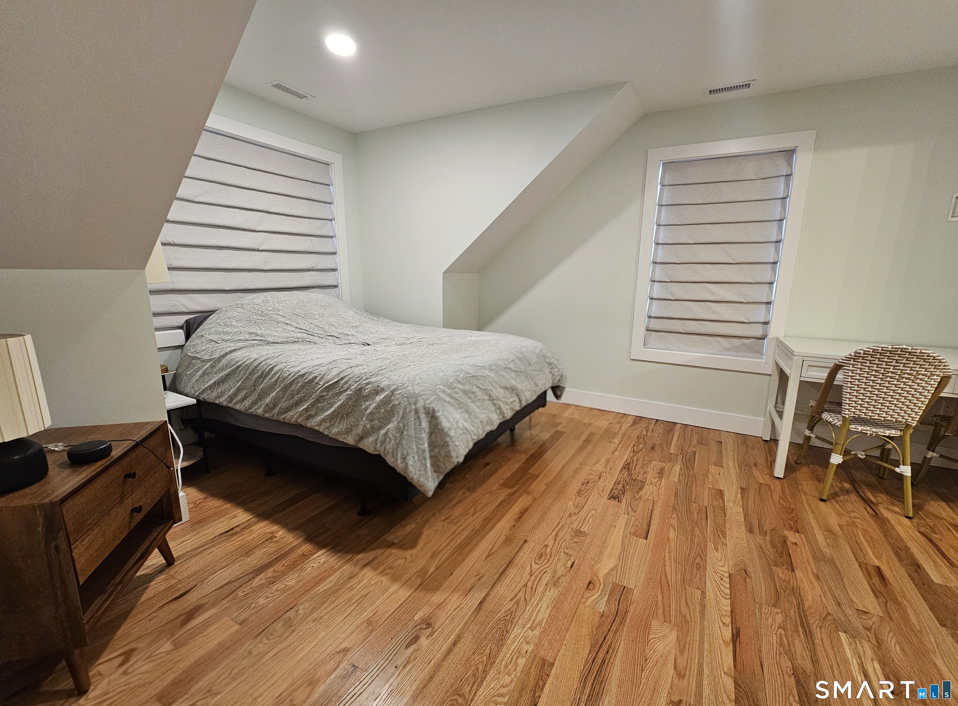 23 Ivy Hill Road, Unit 23 Waterford, CT 06385 - Photo 13 of 28 a bedroom with a bed and wooden floor