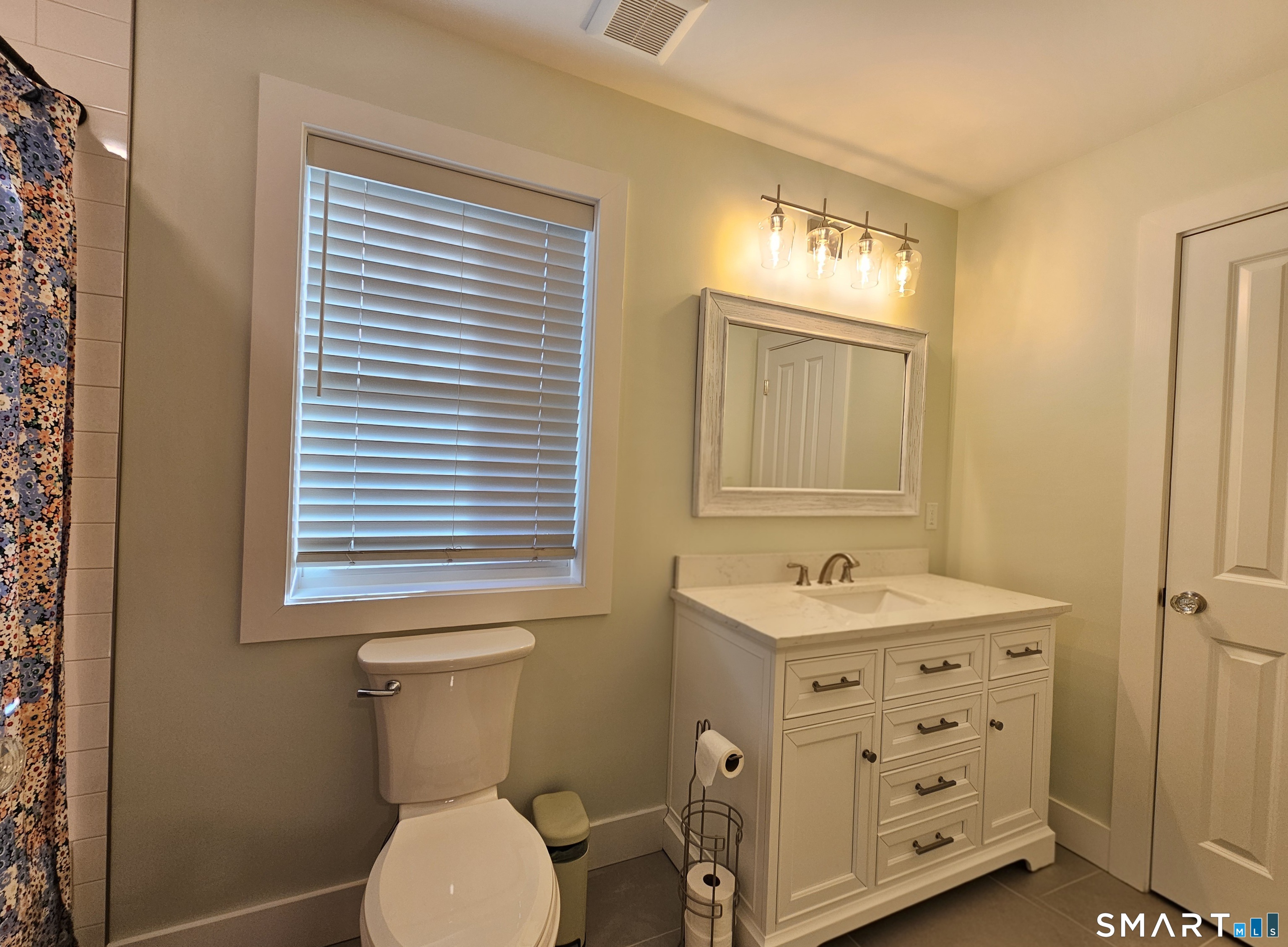 23 Ivy Hill Road, Unit 23 Waterford, CT 06385 - Photo 3 of 28 a bathroom with a sink a toilet and a window