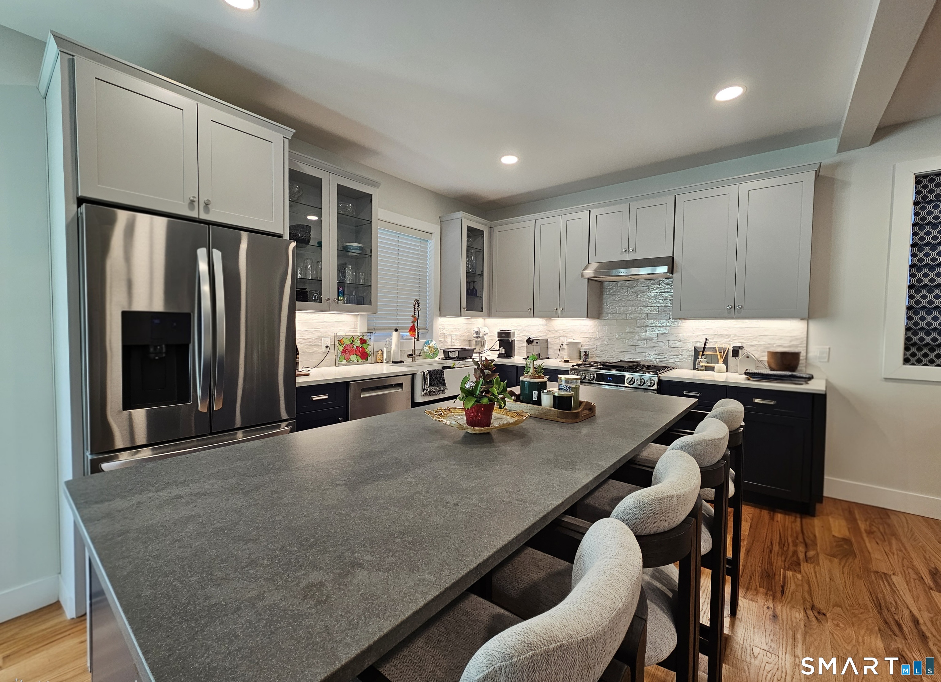 23 Ivy Hill Road, Unit 23 Waterford, CT 06385 - Photo 6 of 28 a kitchen with stainless steel appliances granite countertop a refrigerator stove top oven dining table and chairs
