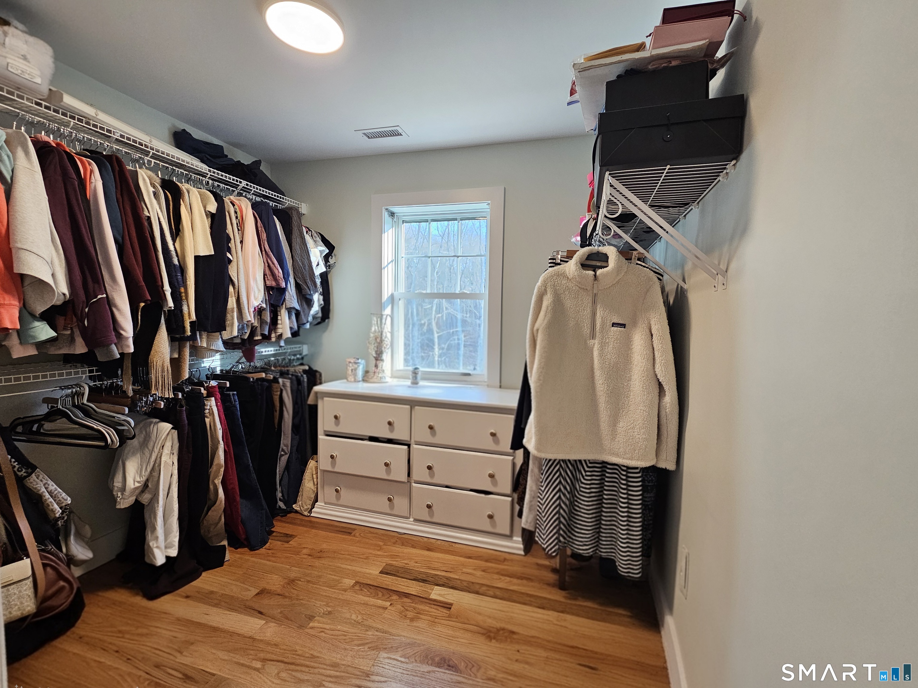 23 Ivy Hill Road, Unit 23 Waterford, CT 06385 - Photo 8 of 28 a view of walk in closet with clothes and shoes