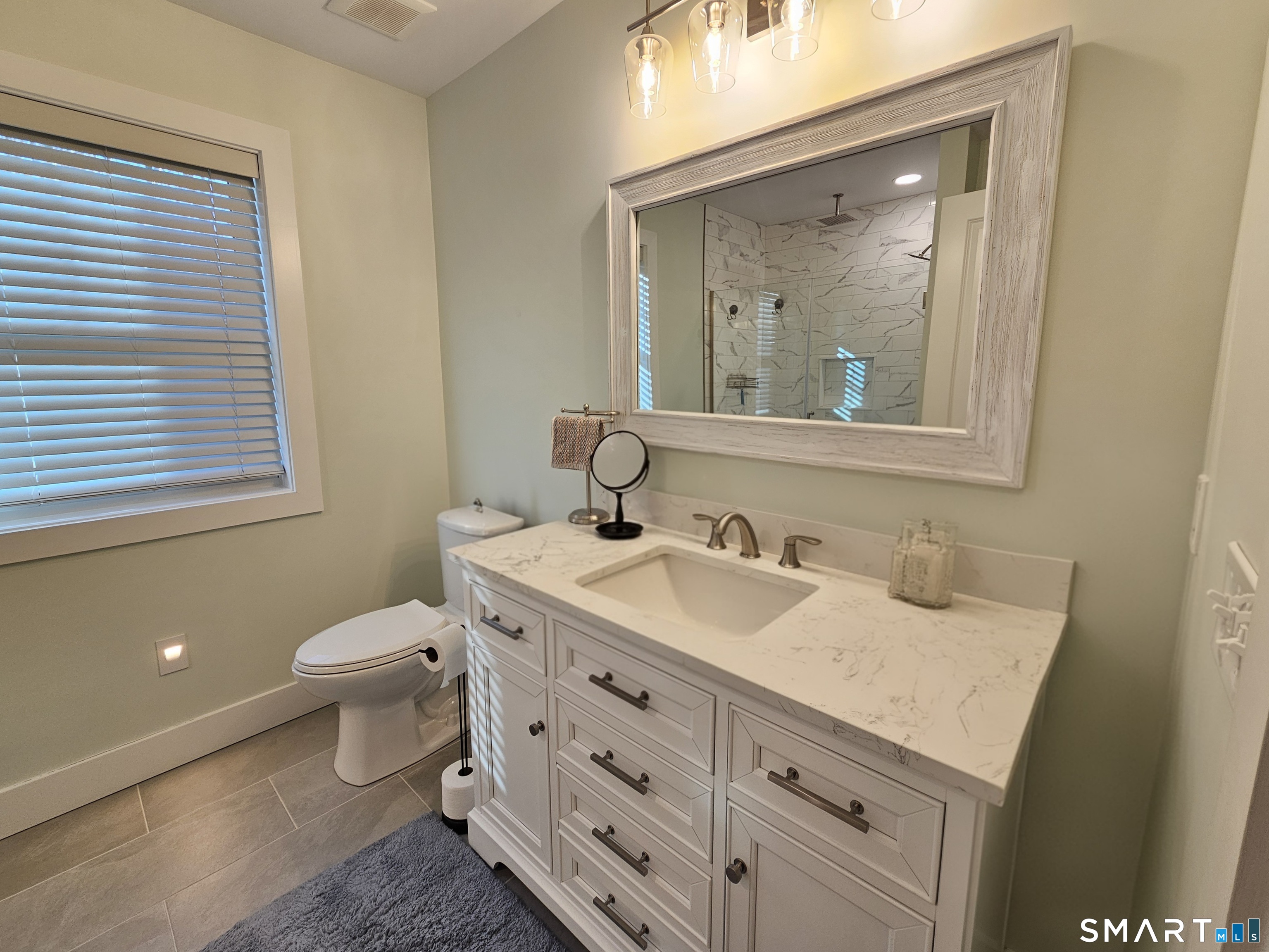 23 Ivy Hill Road, Unit 23 Waterford, CT 06385 - Photo 9 of 28 a bathroom with a sink and a mirror