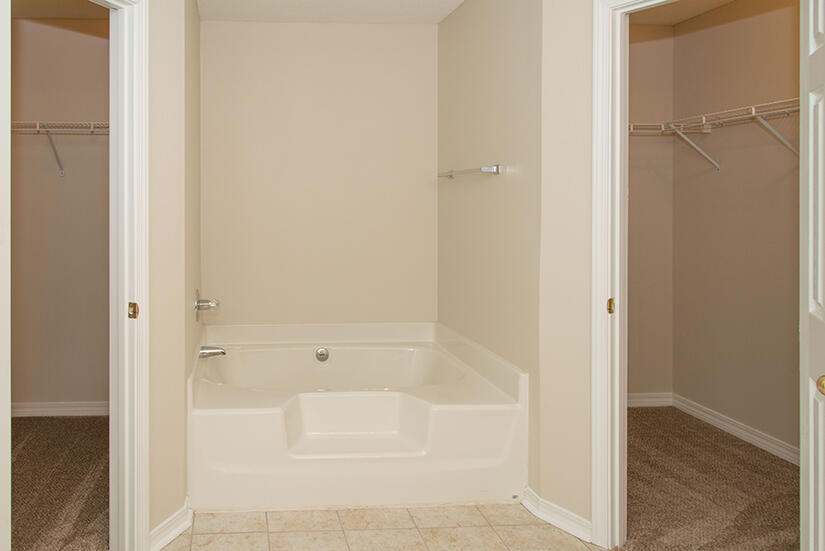 6805 Fernandina Road Navarre, FL 32566 - Photo 17 of 29 a bathroom with a bathtub