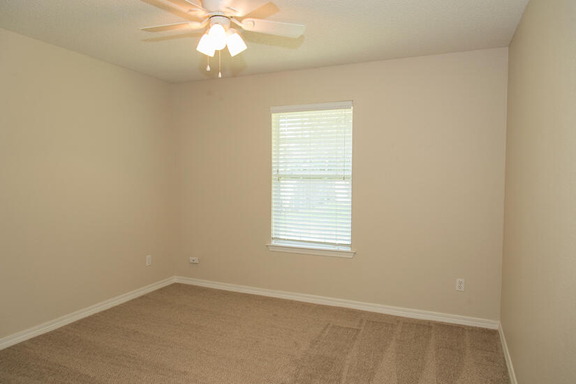 6805 Fernandina Road Navarre, FL 32566 - Photo 20 of 29 an empty room with a window