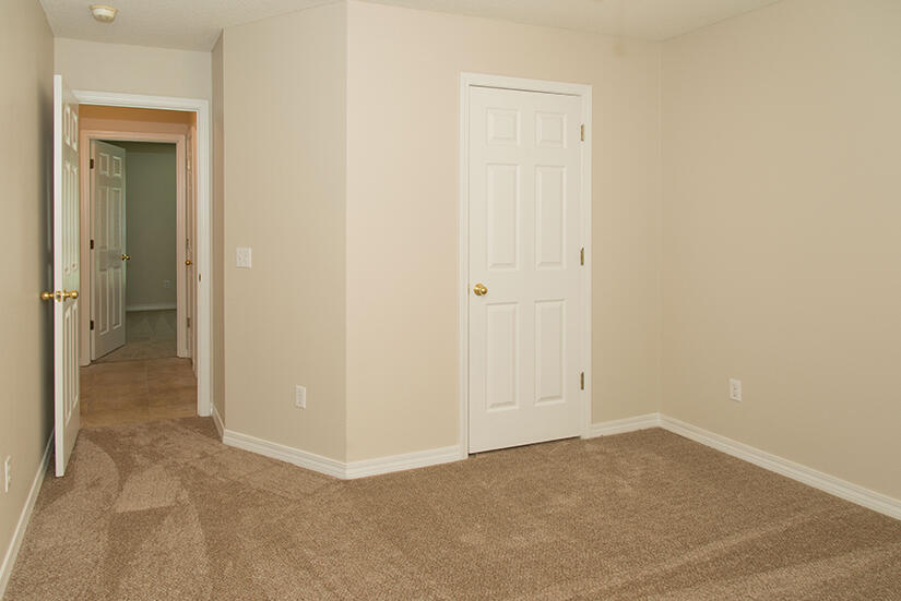 6805 Fernandina Road Navarre, FL 32566 - Photo 21 of 29 wooden floor and closet in a room