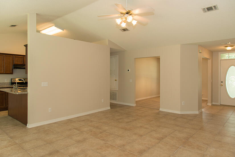 6805 Fernandina Road Navarre, FL 32566 - Photo 6 of 29 a view of a kitchen with a sink and a refrigerator