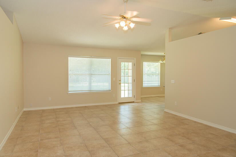 6805 Fernandina Road Navarre, FL 32566 - Photo 8 of 29 a view of an empty room with a window