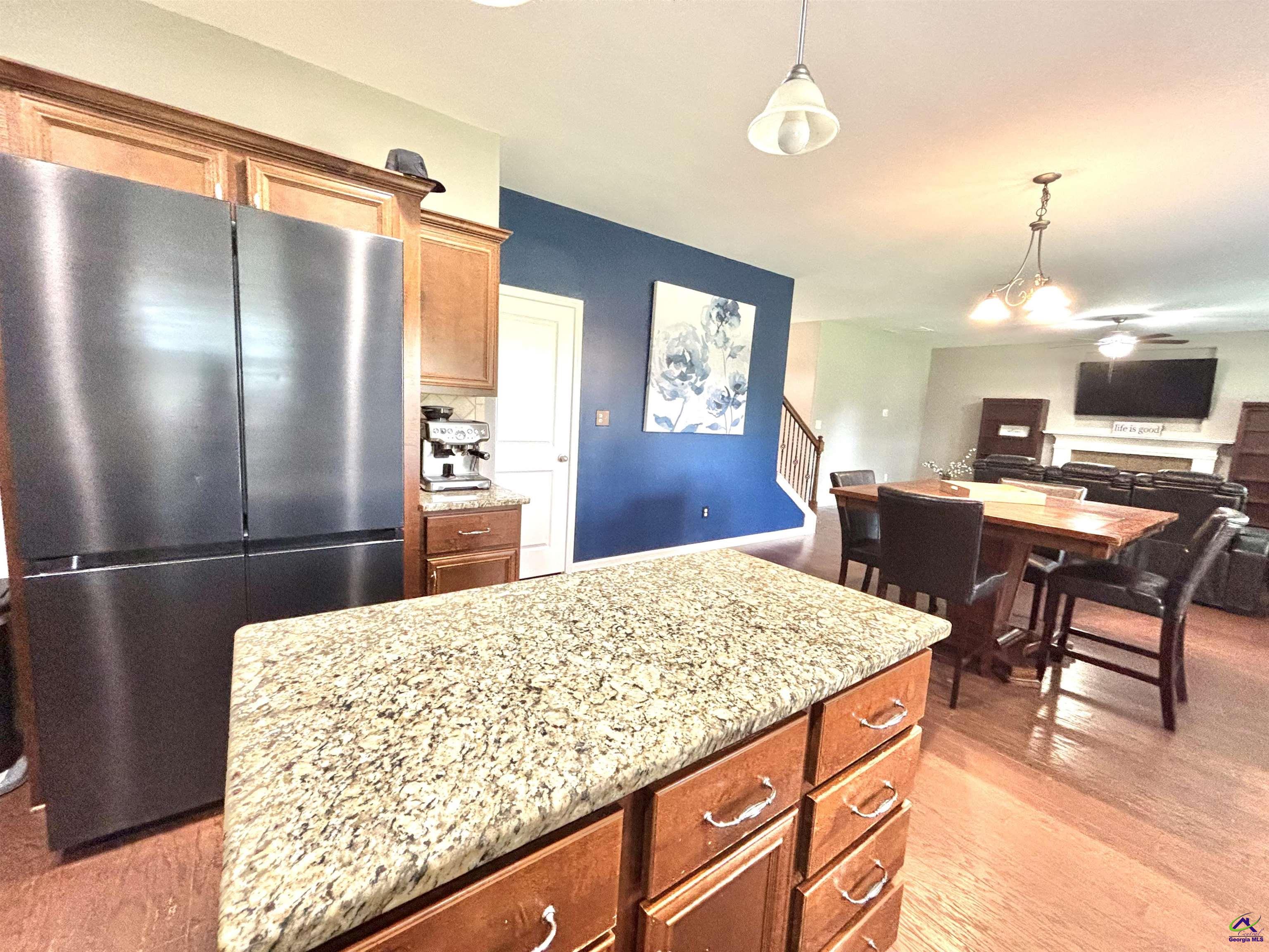 600 Post Oak Way Warner Robins, GA 31088 - Photo 20 of 50 a kitchen with stainless steel appliances kitchen island granite countertop a refrigerator and a stove top oven
