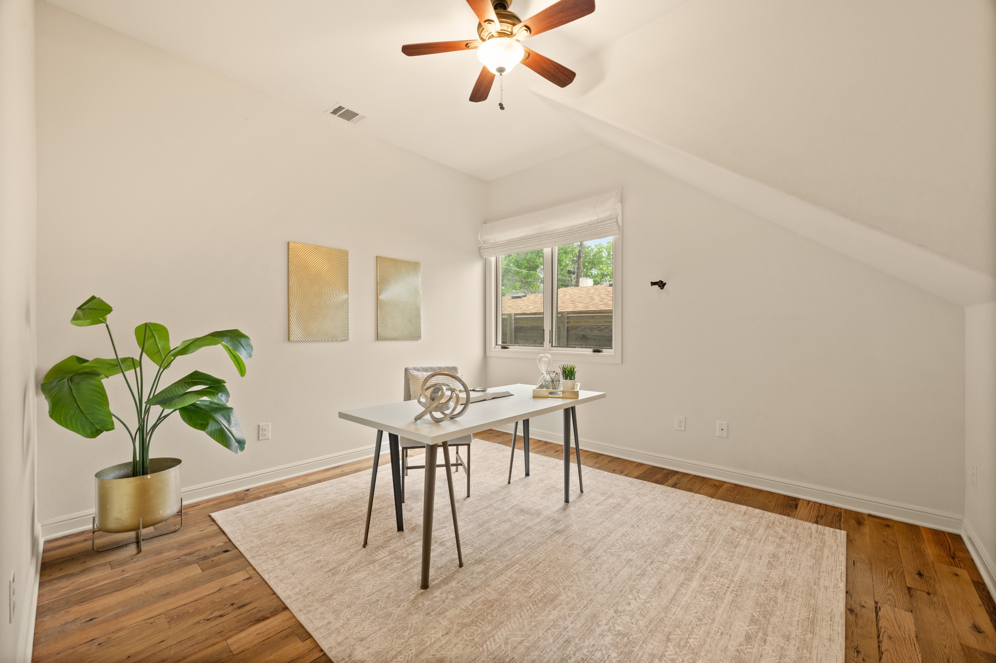 3907 Bailey Lane Austin, TX 78756 - Photo 21 of 40 One bright and beautiful guest room also resides on the main floor, giving overnight guests a quiet space to spend the night